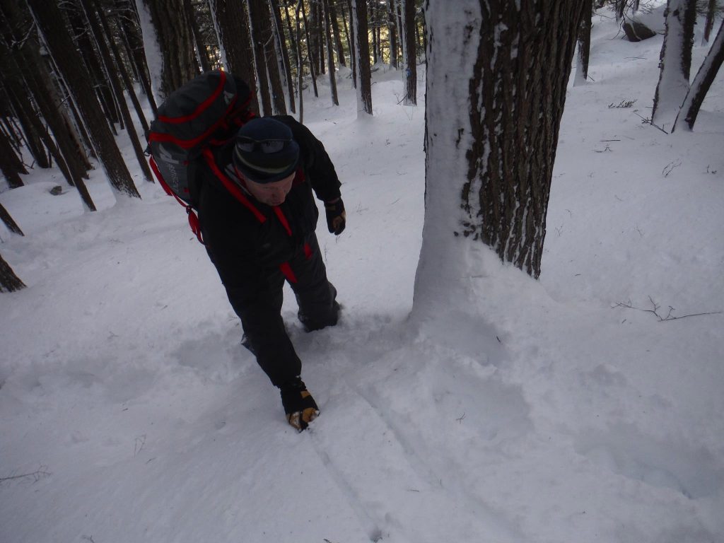 Here our apt pupil uses his ice axe to aid clearing a bulge
